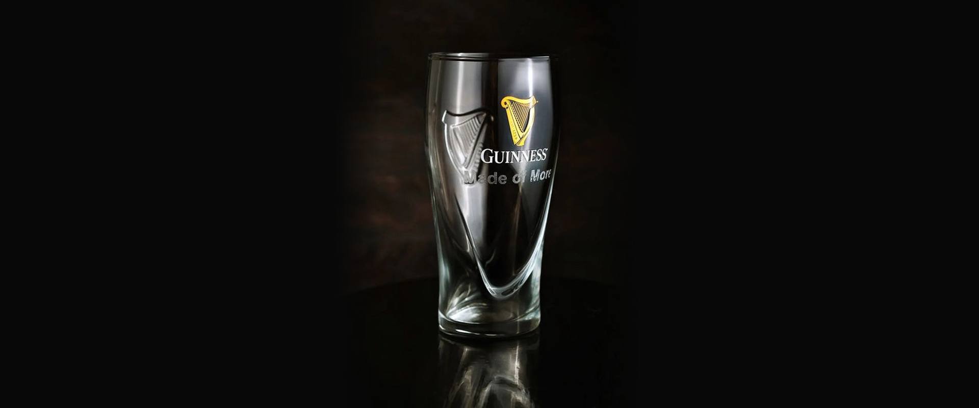 A pint of Guinness settling on a bar